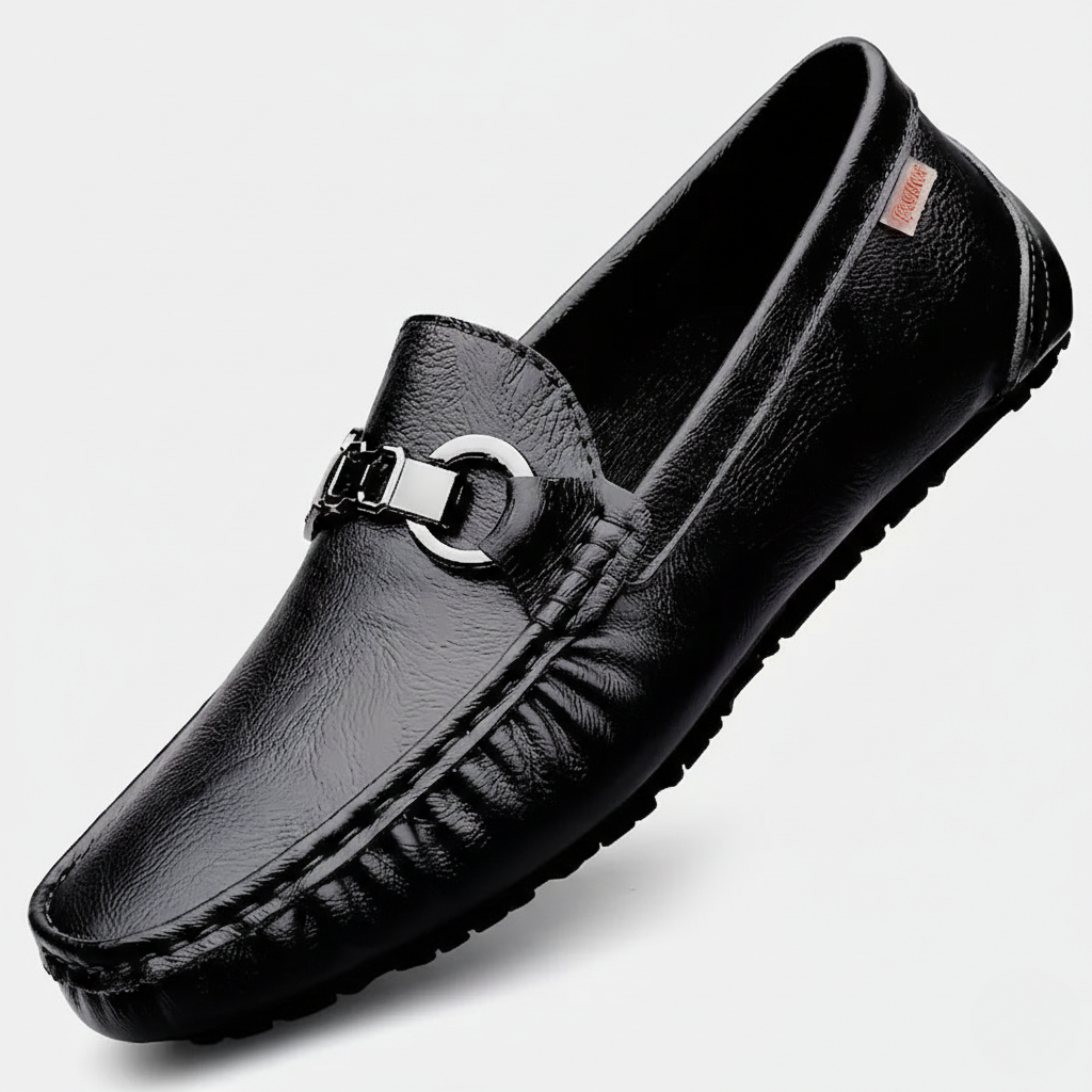 Black pebbled leather driving loafer featuring silver buckle detail