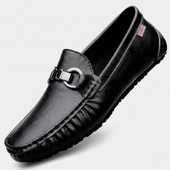 Black pebbled leather driving loafer featuring silver buckle detail