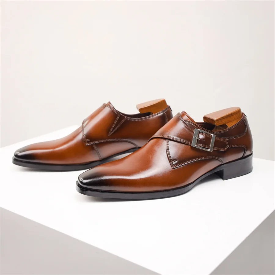 Tan leather monk strap shoes with buckle detail and pointed toe