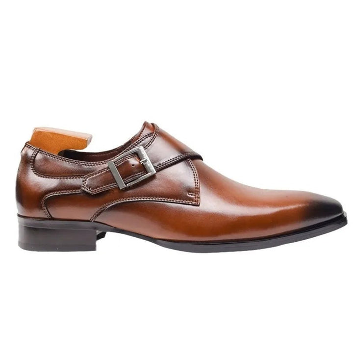 Brown leather monk strap dress shoe with silver buckle, side profile