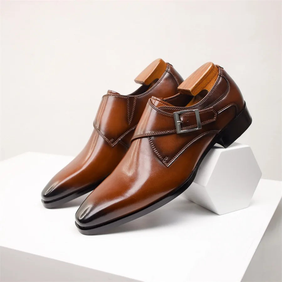 Tan leather monk strap shoes with wooden shoe trees and buckle fastening