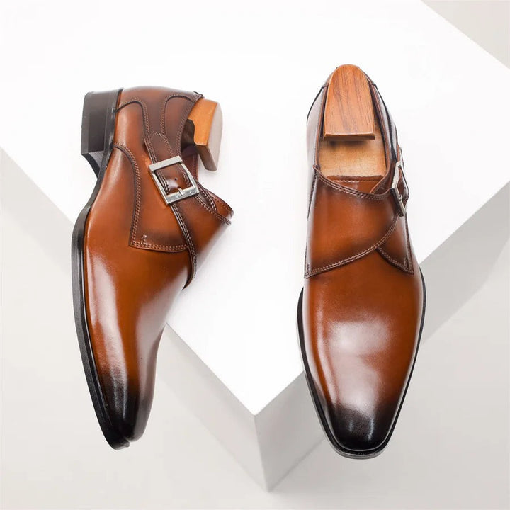 Brown leather monk strap shoes viewed from above showing pointed toes