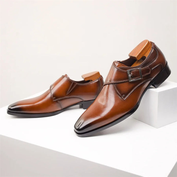 Tan leather monk strap dress shoes with buckle strap and glossy finish