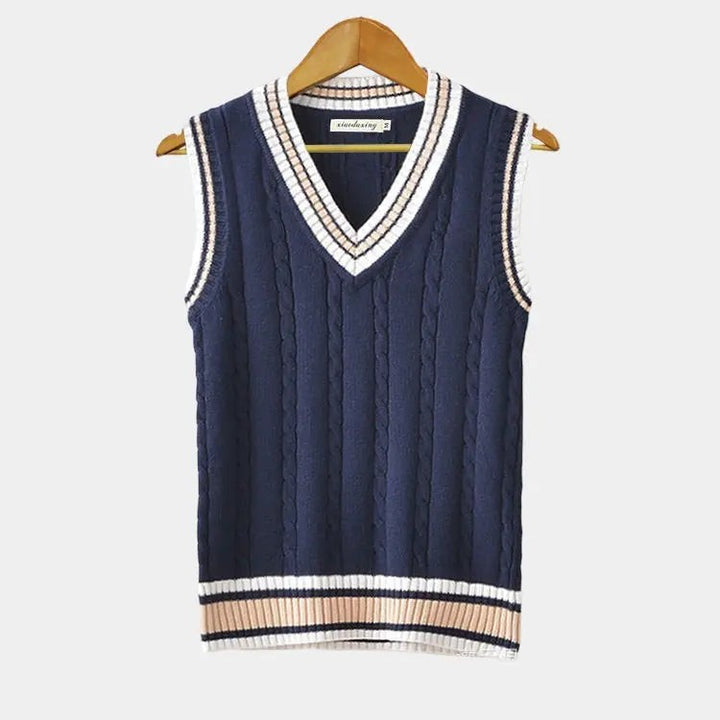 Navy cable-knit sweater vest featuring white and beige striped ribbed trim