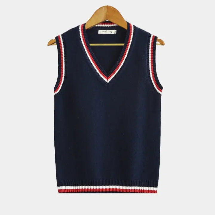 Navy knitted sweater vest with red and white striped V-neck trim