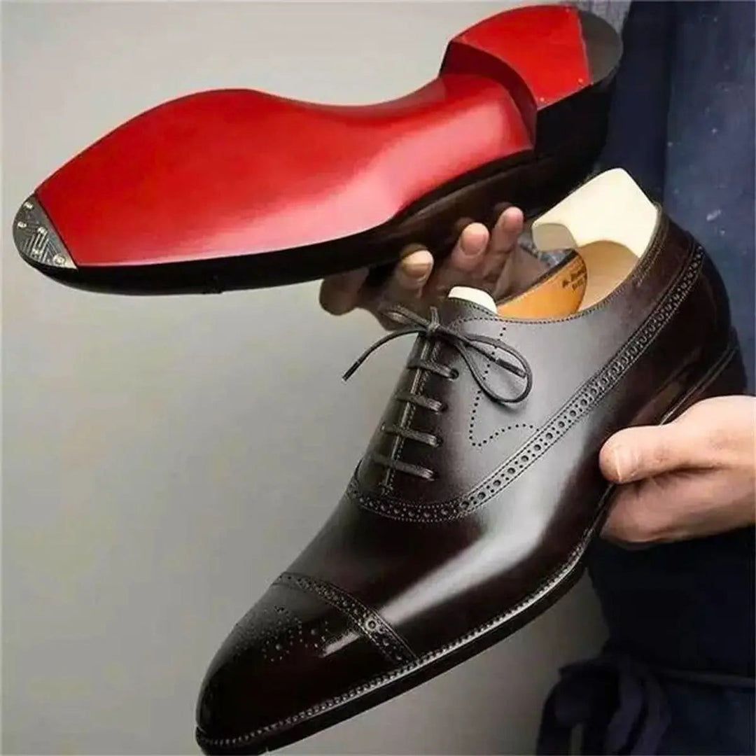 Dark brown leather brogue Oxford shoe with red sole and shoe tree