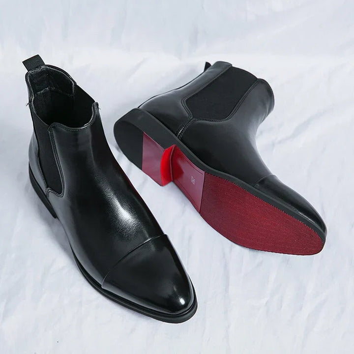 Men's black leather Chelsea boots with elastic side panel and red contrast sole