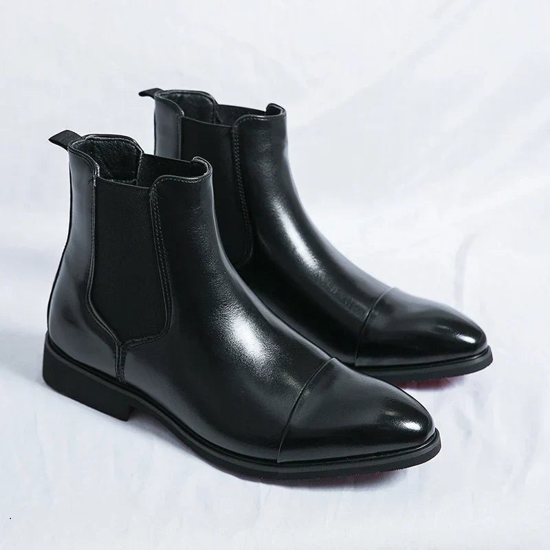 Pair of black leather slip-on Chelsea boots with cap toe and low block heel