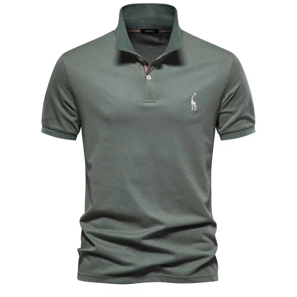 Sage green polo shirt with contrast placket and subtle giraffe embroidery