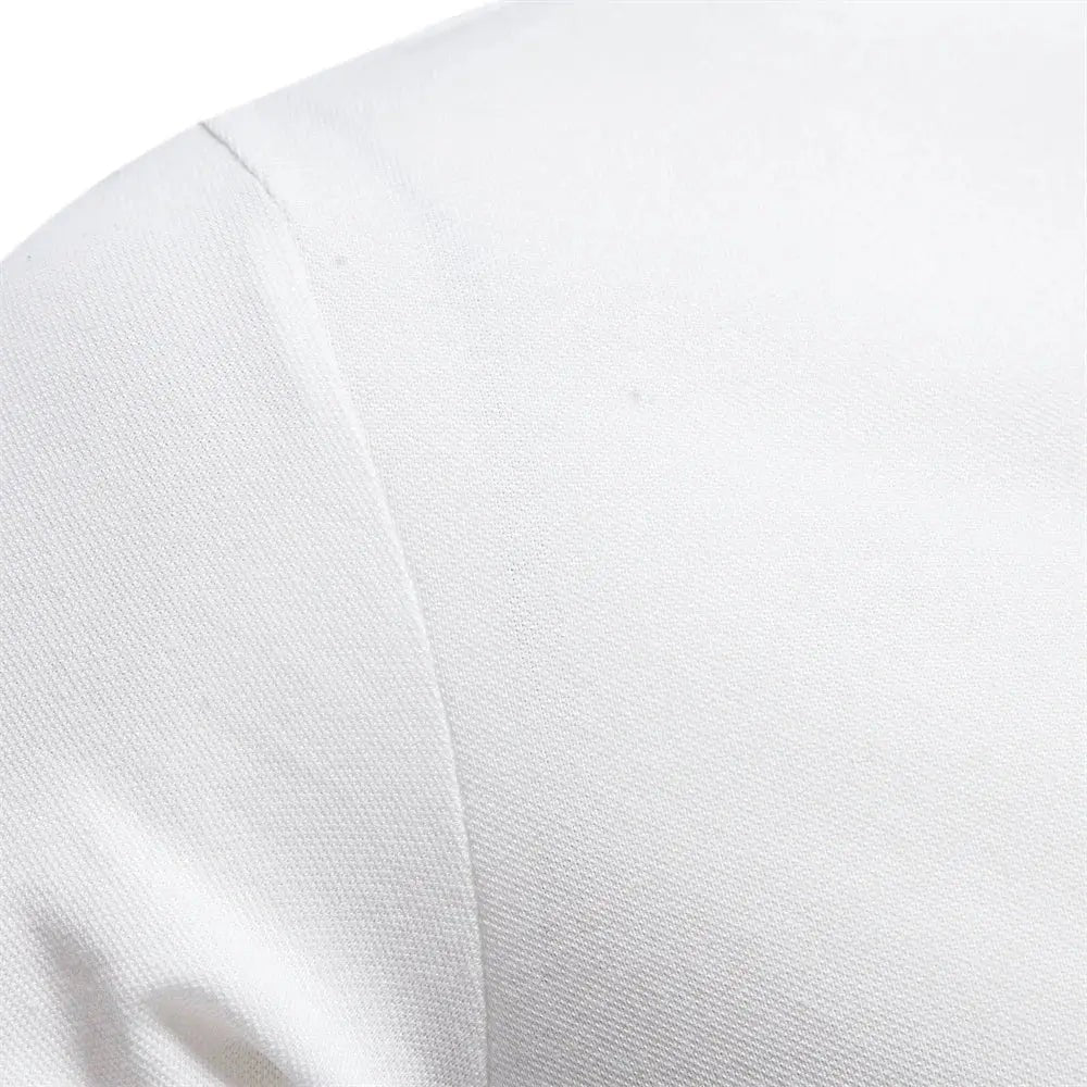 Close-up of white polo shirt sleeve seam showing textured pique cotton fabric