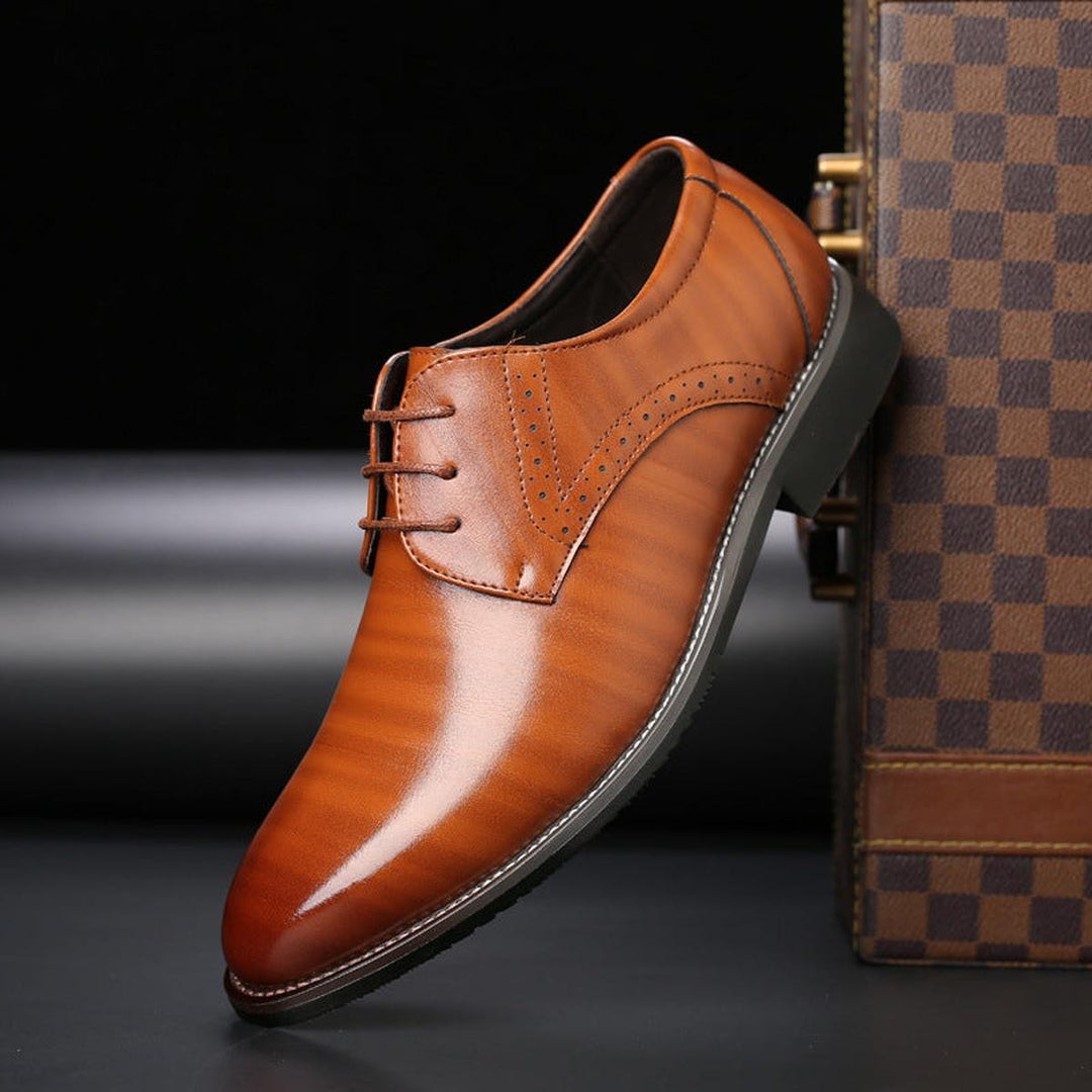 Tan leather lace-up formal shoe featuring polished pointed toe finish