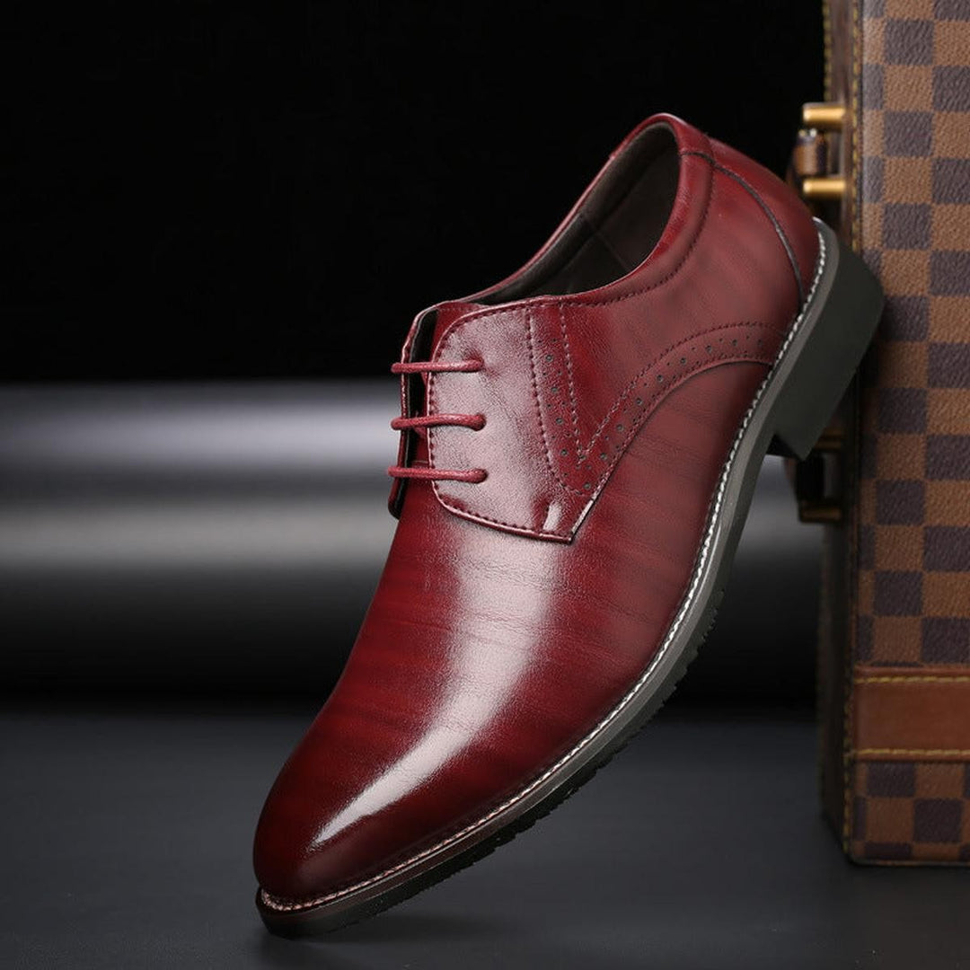 Burgundy leather formal lace-up shoe with sleek pointed toe design