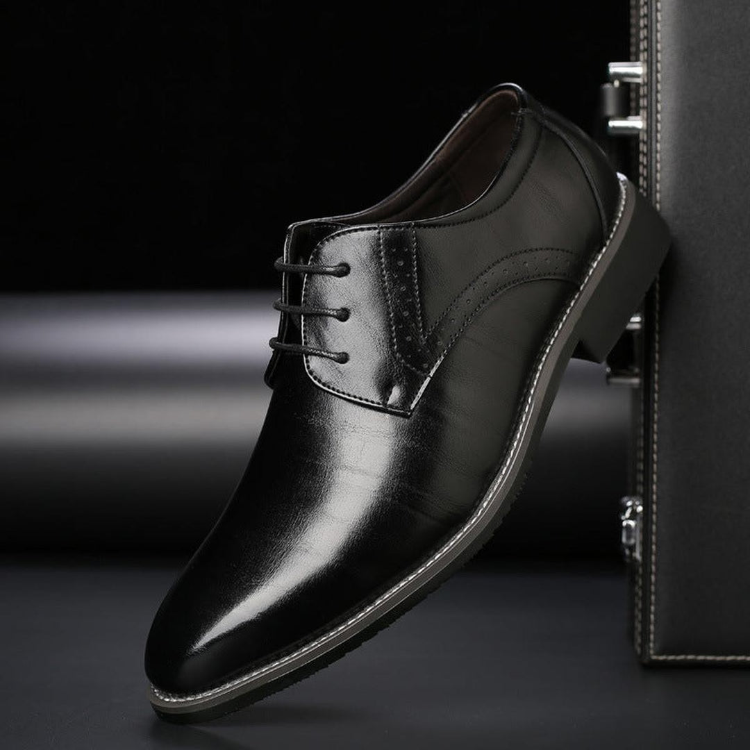 Black leather lace-up formal shoe with polished finish and pointed toe