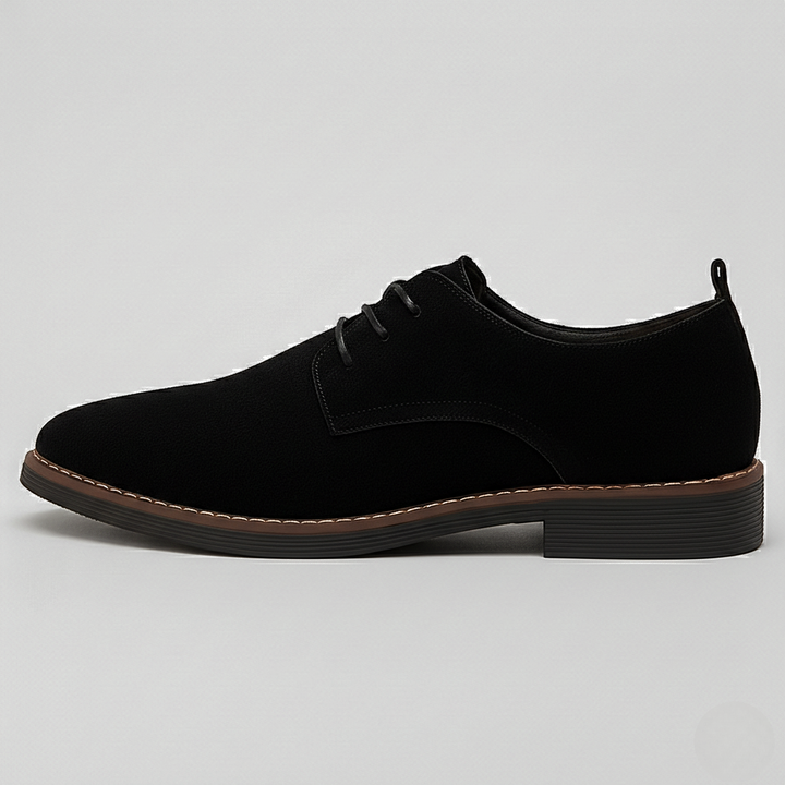 Side profile of black suede Derby shoe with tan contrast sole