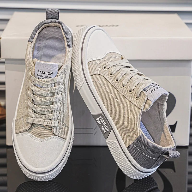 Stone beige canvas trainers with grey heel tabs and white textured soles