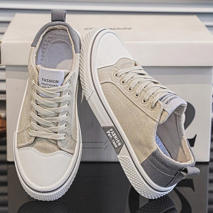 Stone beige canvas trainers with grey heel tabs and white textured soles