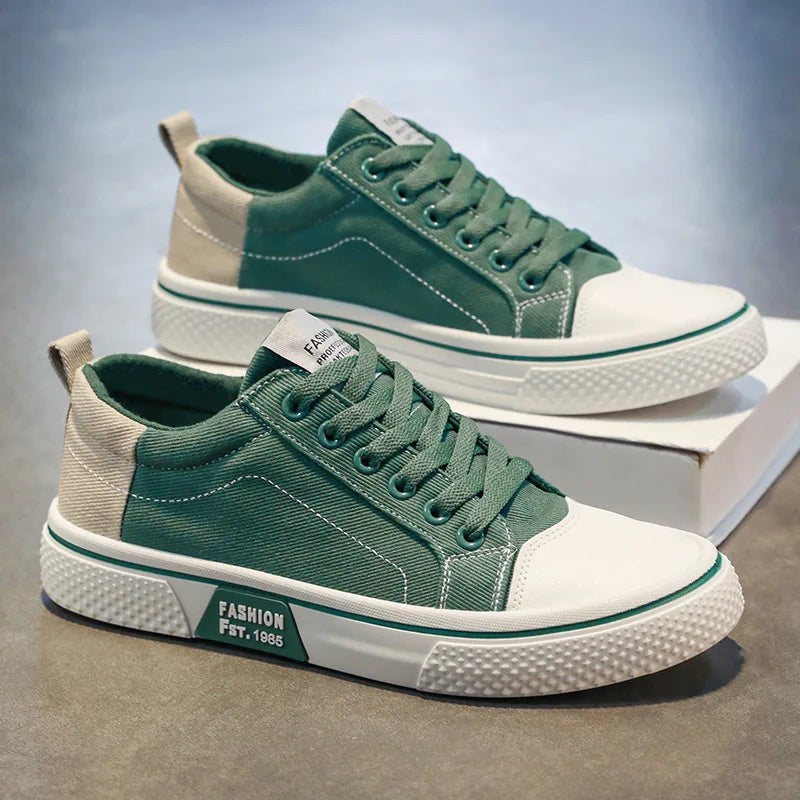 Green low-top canvas sneakers showing white toe caps and ribbed rubber soles
