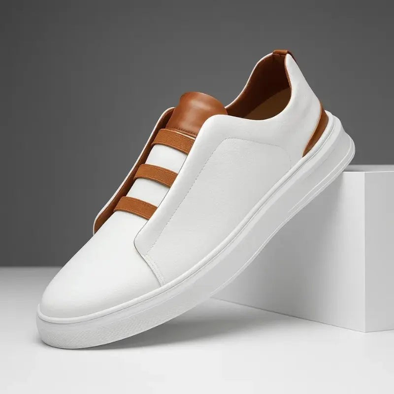 White leather slip-on trainers with tan elastic loop lacing and heel trim