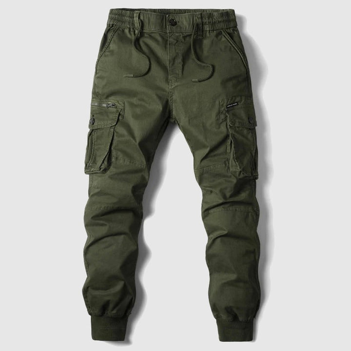 Olive green cargo joggers with multiple flap pockets and ribbed hem, flat lay
