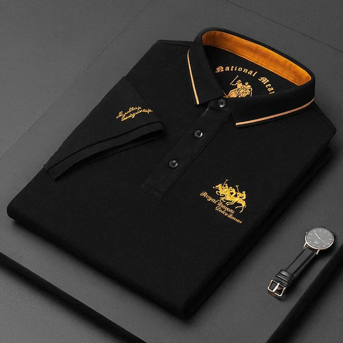 Black men's polo shirt folded with gold-striped collar and embroidered horse emblem