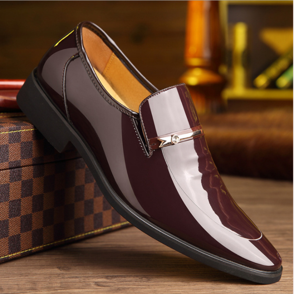 Burgundy patent leather loafer with pointed toe and diamante buckle accent