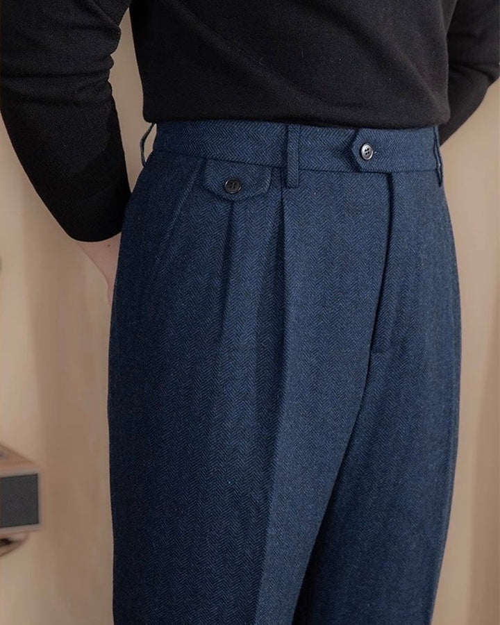 Navy herringbone tweed trousers with tailored waistband and buttoned side adjuster