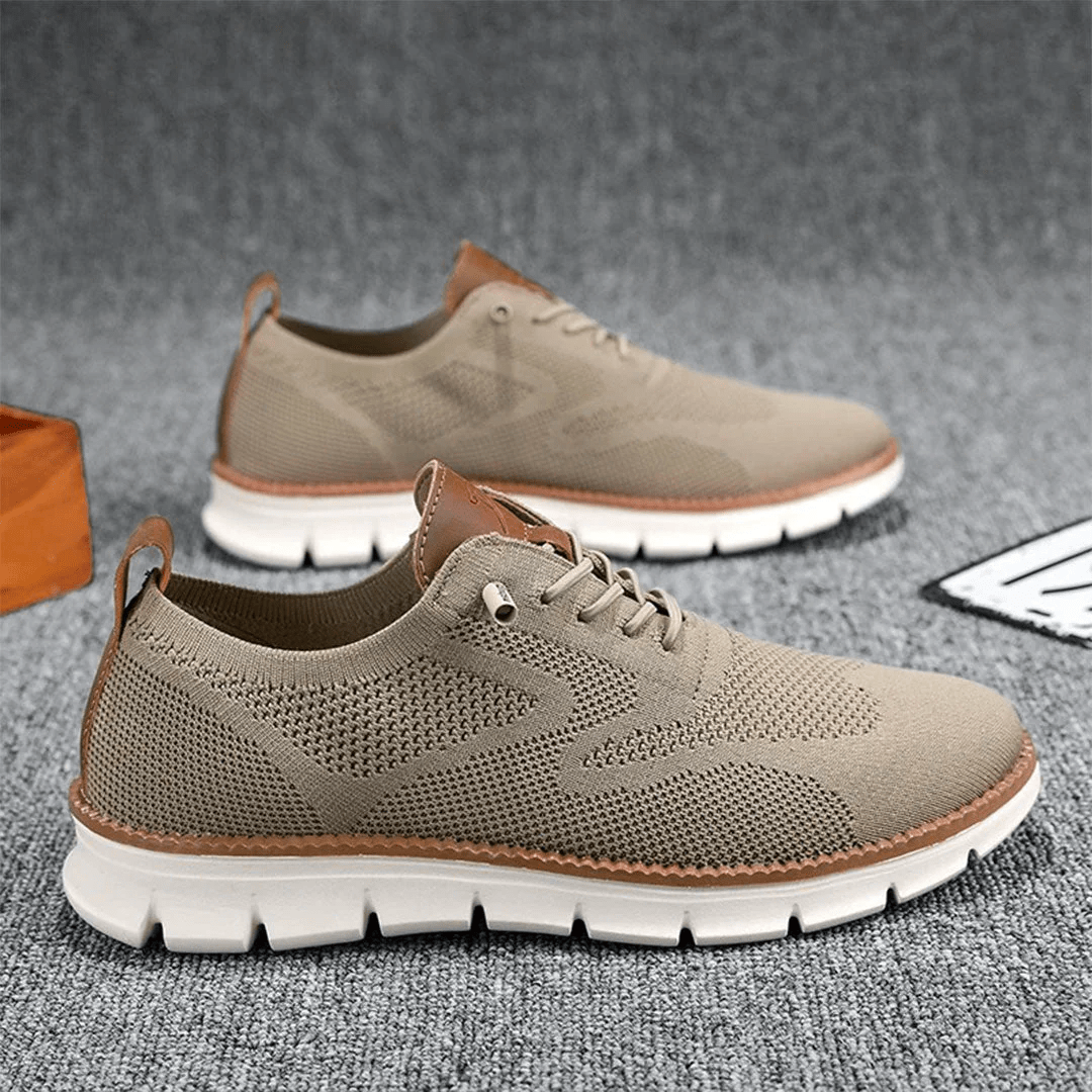 Beige knitted lace-up trainers with white ridged sole and leather accents