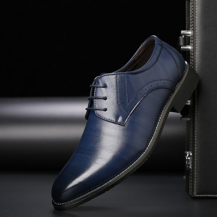 Navy leather men's Derby shoe featuring lace-up front and brogue accents