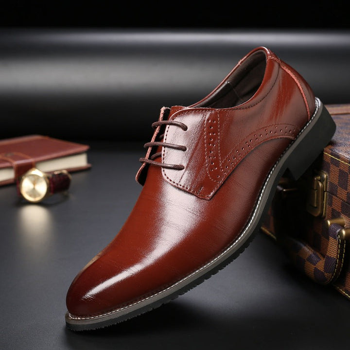 Brown leather lace-up Derby shoe with subtle brogue perforations and shine