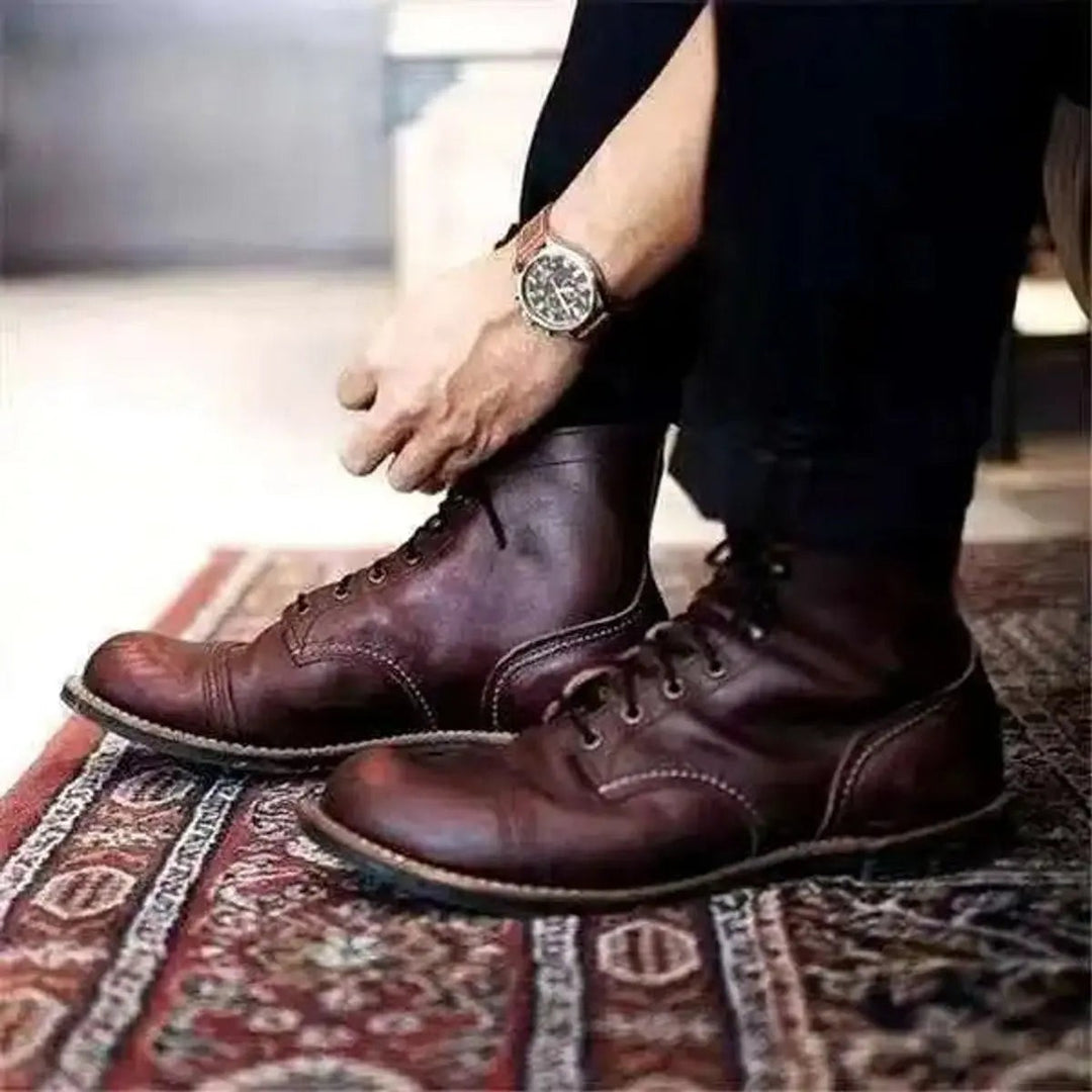 Deep brown leather lace-up ankle boots with distressed cap-toe finish