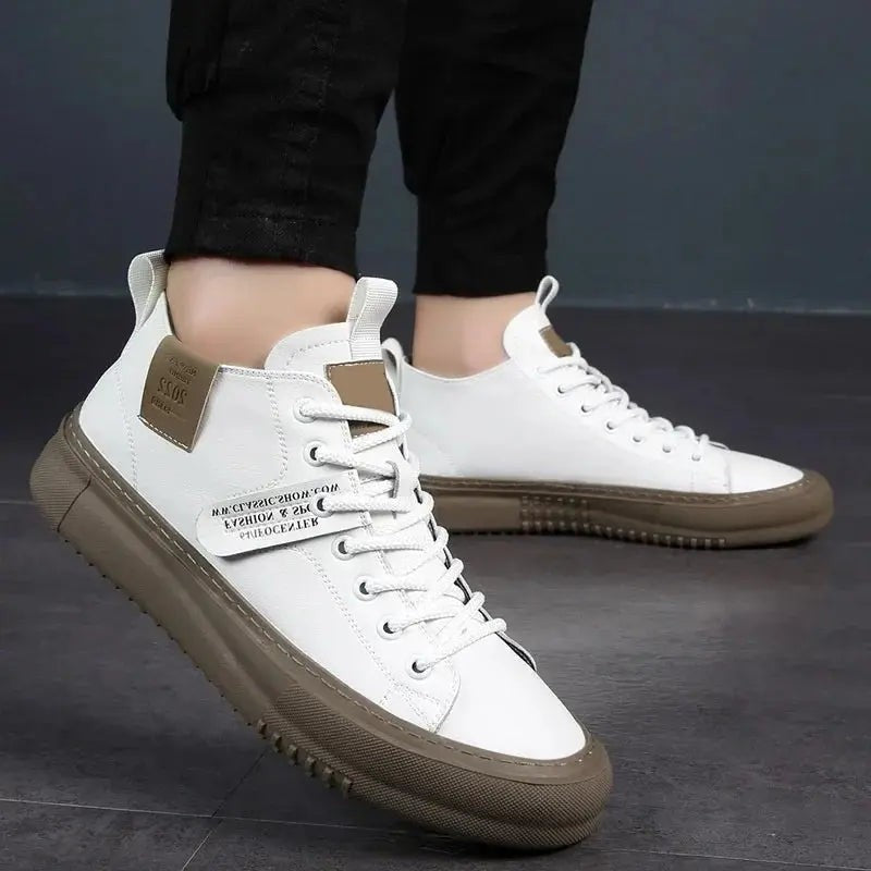 Man wearing white high-top trainers styled with black cropped trousers