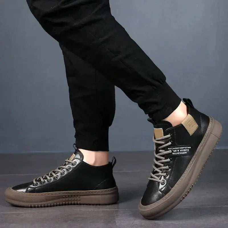 Side angle of black high-top trainers showing textured brown sole detail