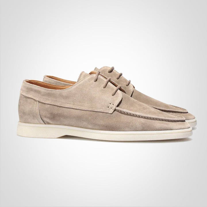 Taupe suede boat derby loafers featuring white sole and moc-toe stitched detailing
