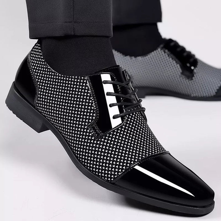 Textured Oxford shoes worn with tailored trousers, showing contrast lace panel