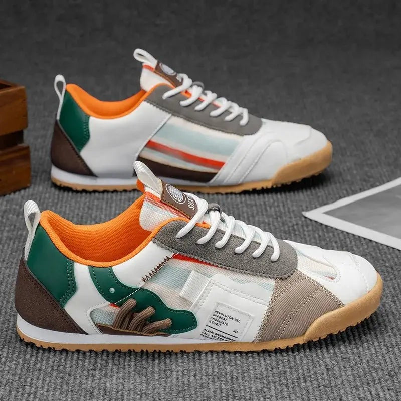 Green and orange multi-panel trainers with grey suede toe and gum sole