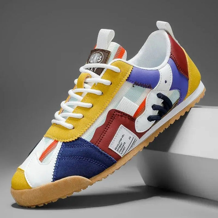 Colour-block trainer in mustard, navy and burgundy with white leather base