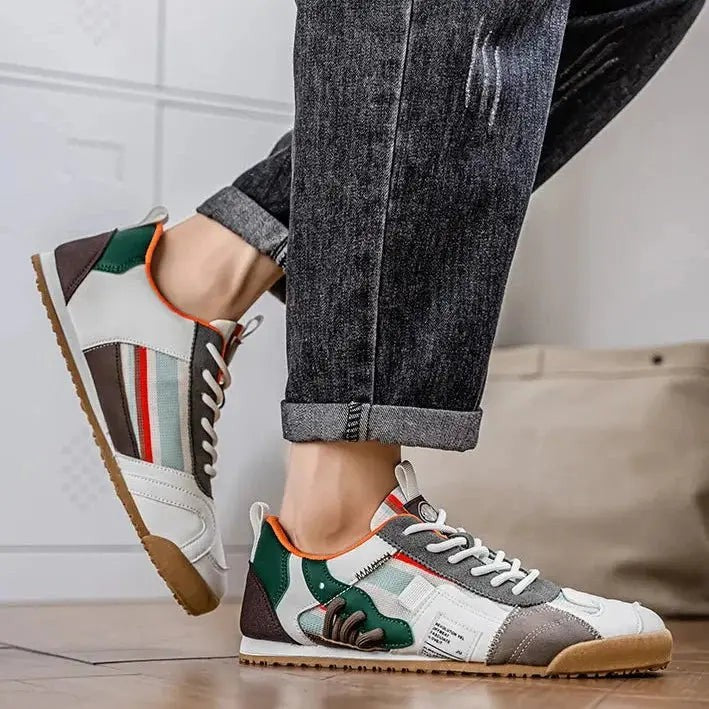 Side view of green and grey utility trainers with contrast stitching