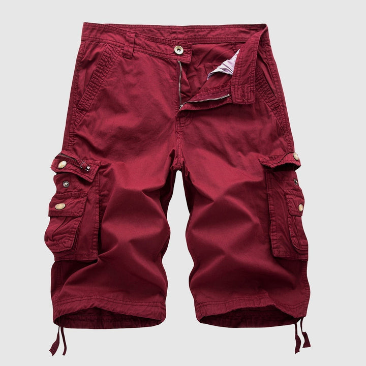 Burgundy red cargo shorts with buttoned flap pockets and elasticated hems
