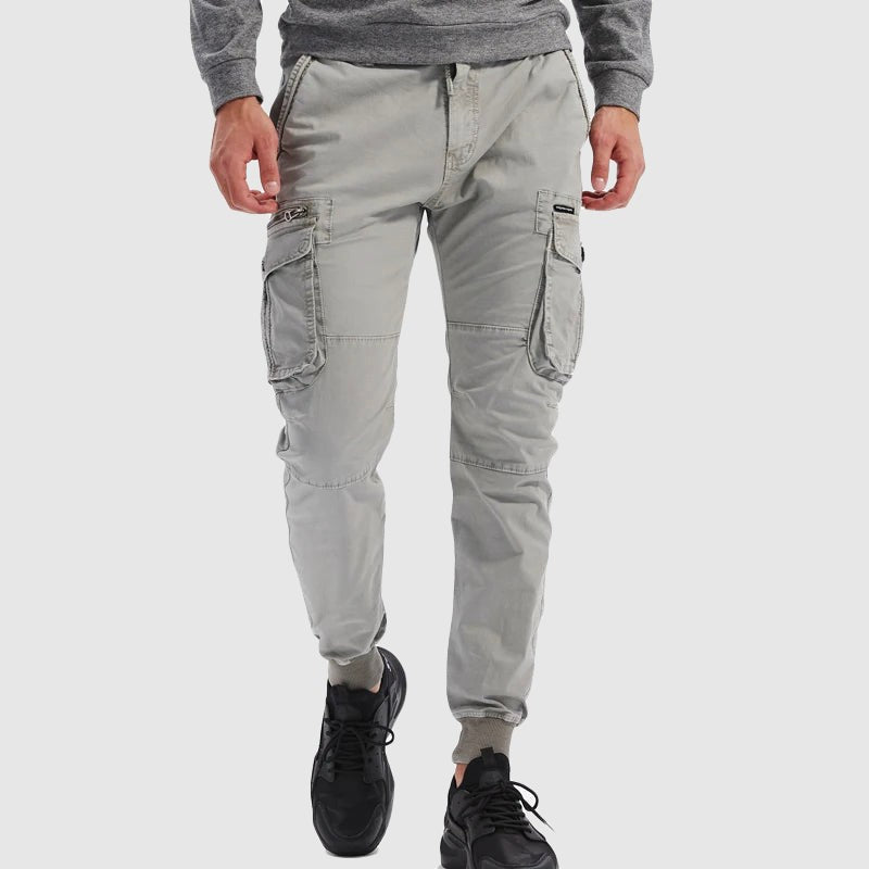 Light grey cargo joggers styled with trainers, drawstring waist and ribbed cuffs