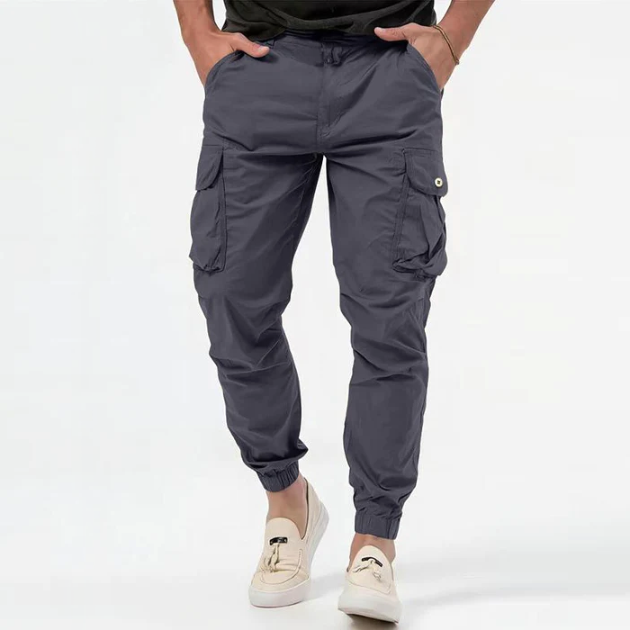 Grey cargo joggers with buttoned side pockets and elasticated cuffs on model