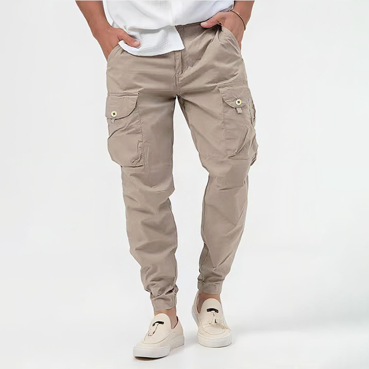 Beige multi-pocket cargo joggers with buttoned flaps and tapered elasticated hem