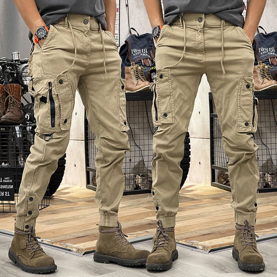 Khaki cargo trousers with multiple pockets, drawstring waist and cuffed ankles