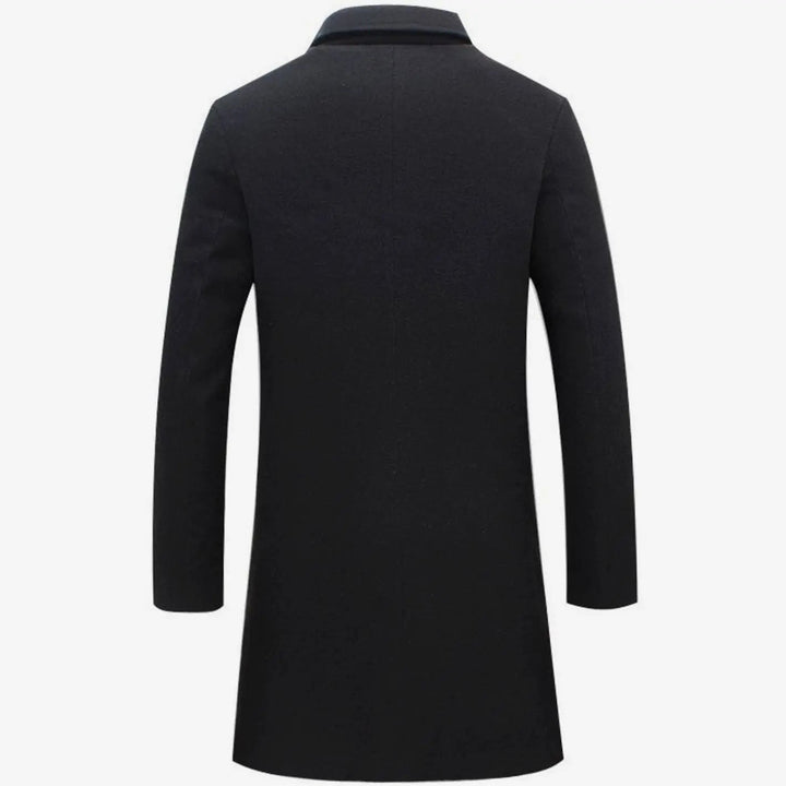 Rear view of black wool-blend overcoat showing tailored fit and long sleeves