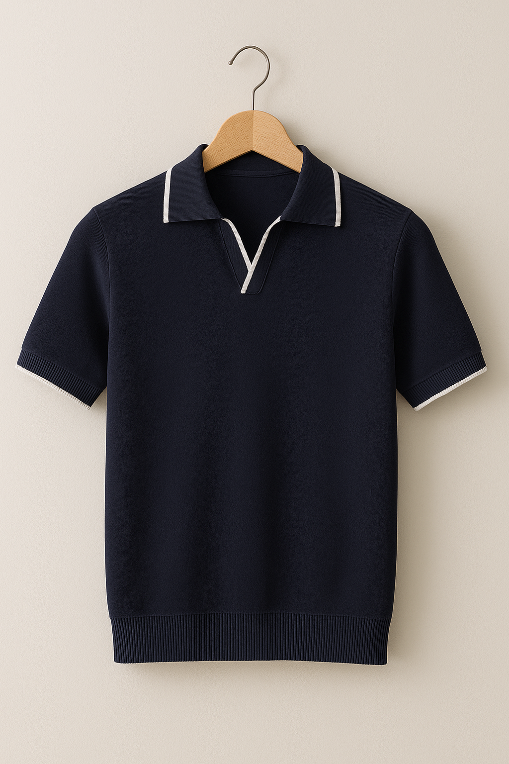 Navy short sleeve knit polo with contrast white collar tipping on hanger