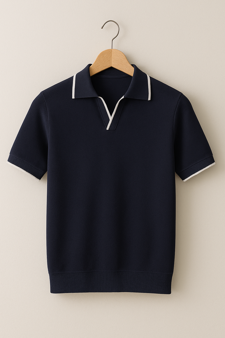 Navy short sleeve knit polo with contrast white collar tipping on hanger