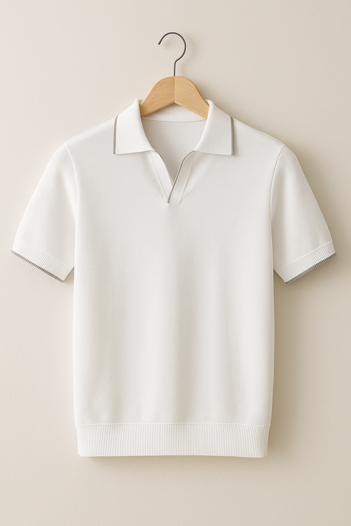Ivory short sleeve knit polo with subtle grey tipped collar on hanger
