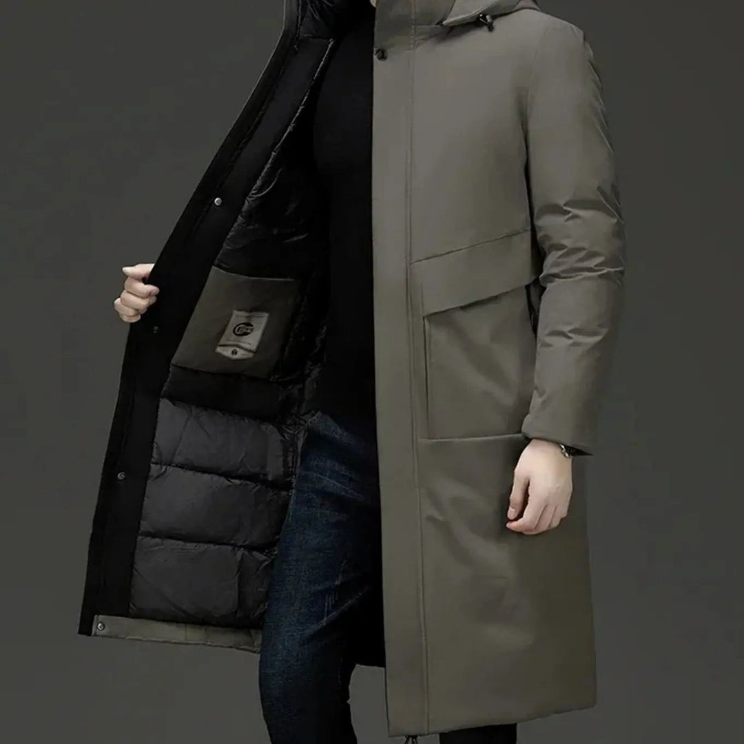Khaki hooded long-line puffer coat with quilted black lining and patch pockets