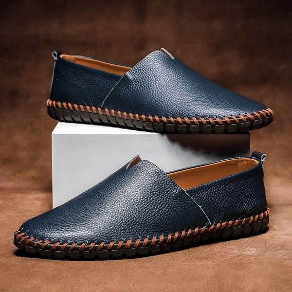 Navy pebbled-grain leather loafers with contrast stitched sole detail