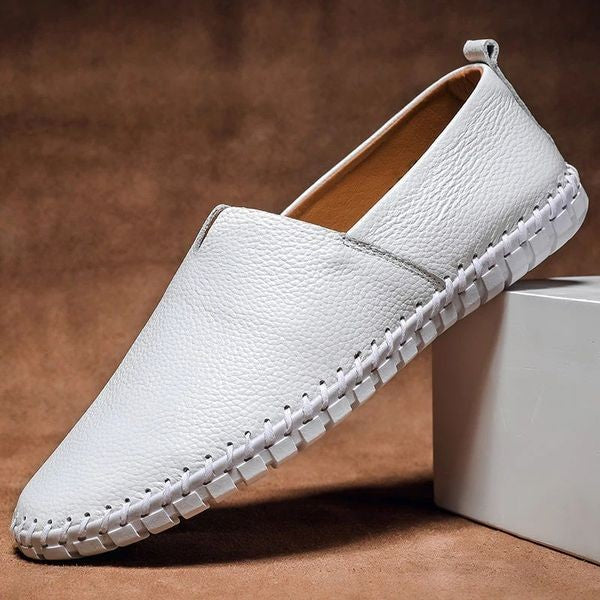 White pebbled-grain leather slip-on loafers with woven stitched trim