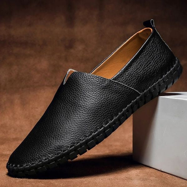 Black pebbled-grain leather loafers with subtle hand-stitched detailing